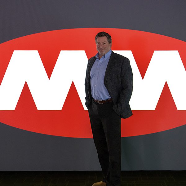 Gus in front of MM sign